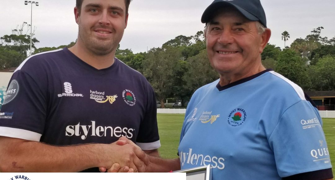 Doug McGrath receives his volunteer award from Sam Gainsford