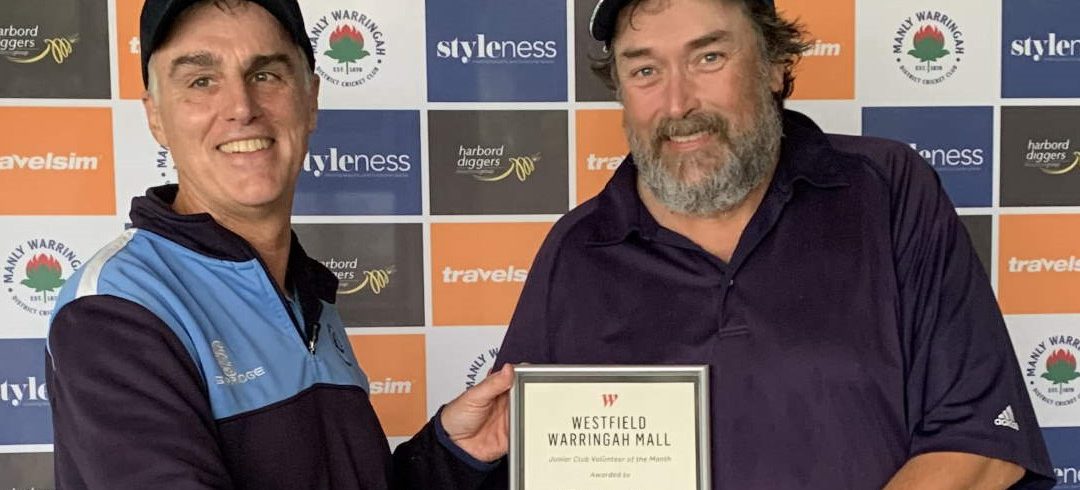 Brendan James receives his volunteer award from Ross Denny